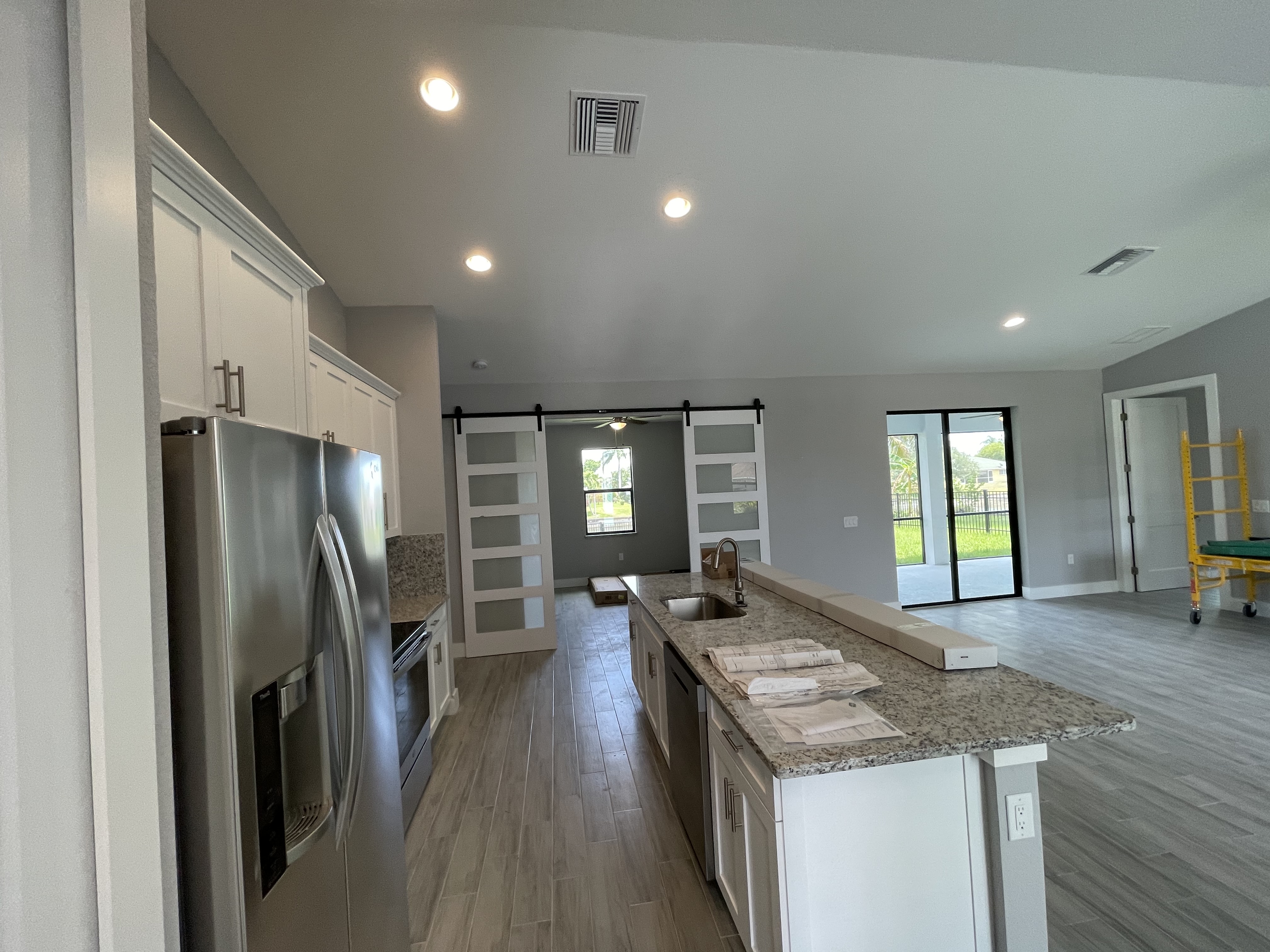Raven kitchen with island and barn doors