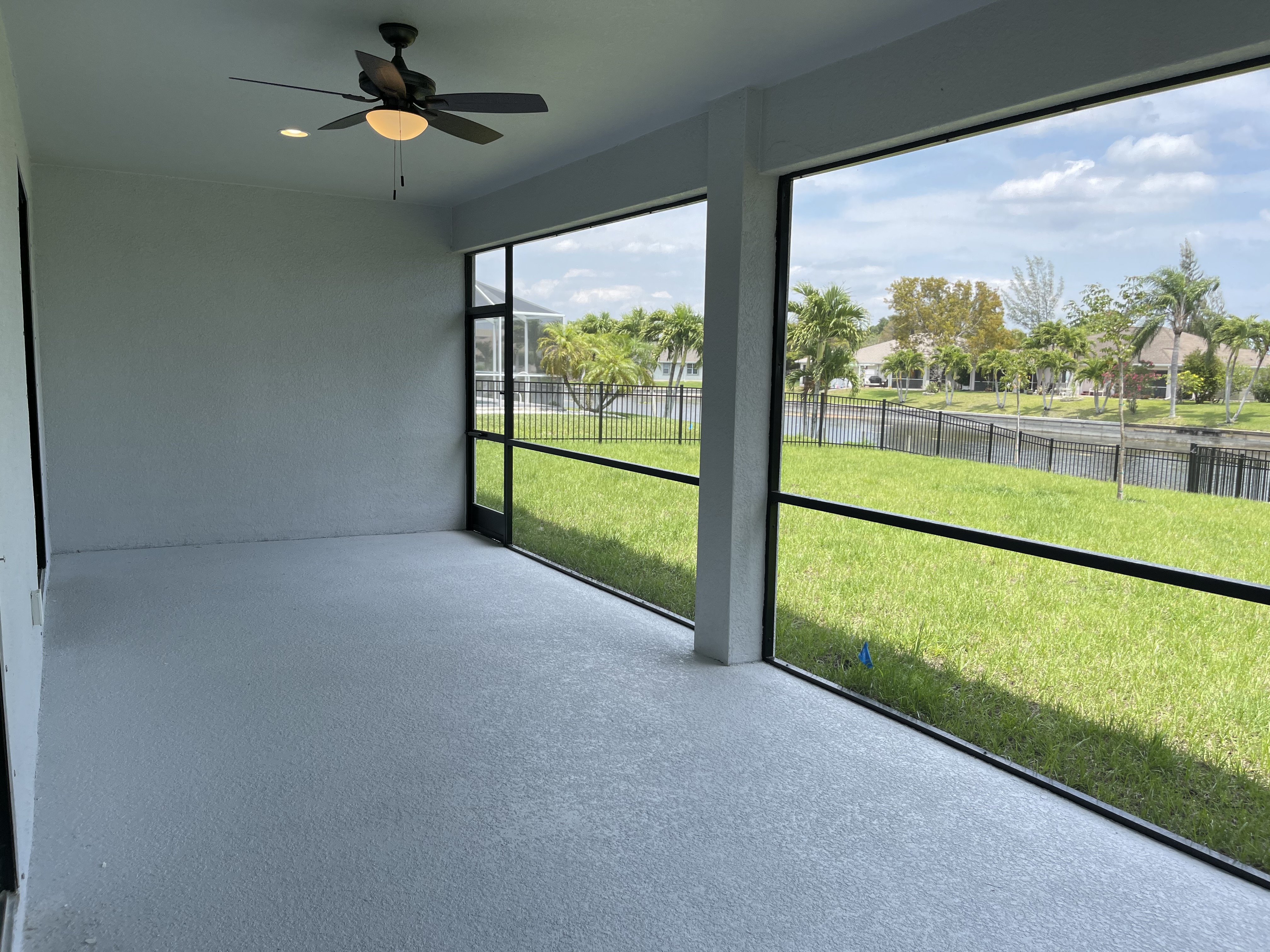 Raven covered lanai with waterfront view