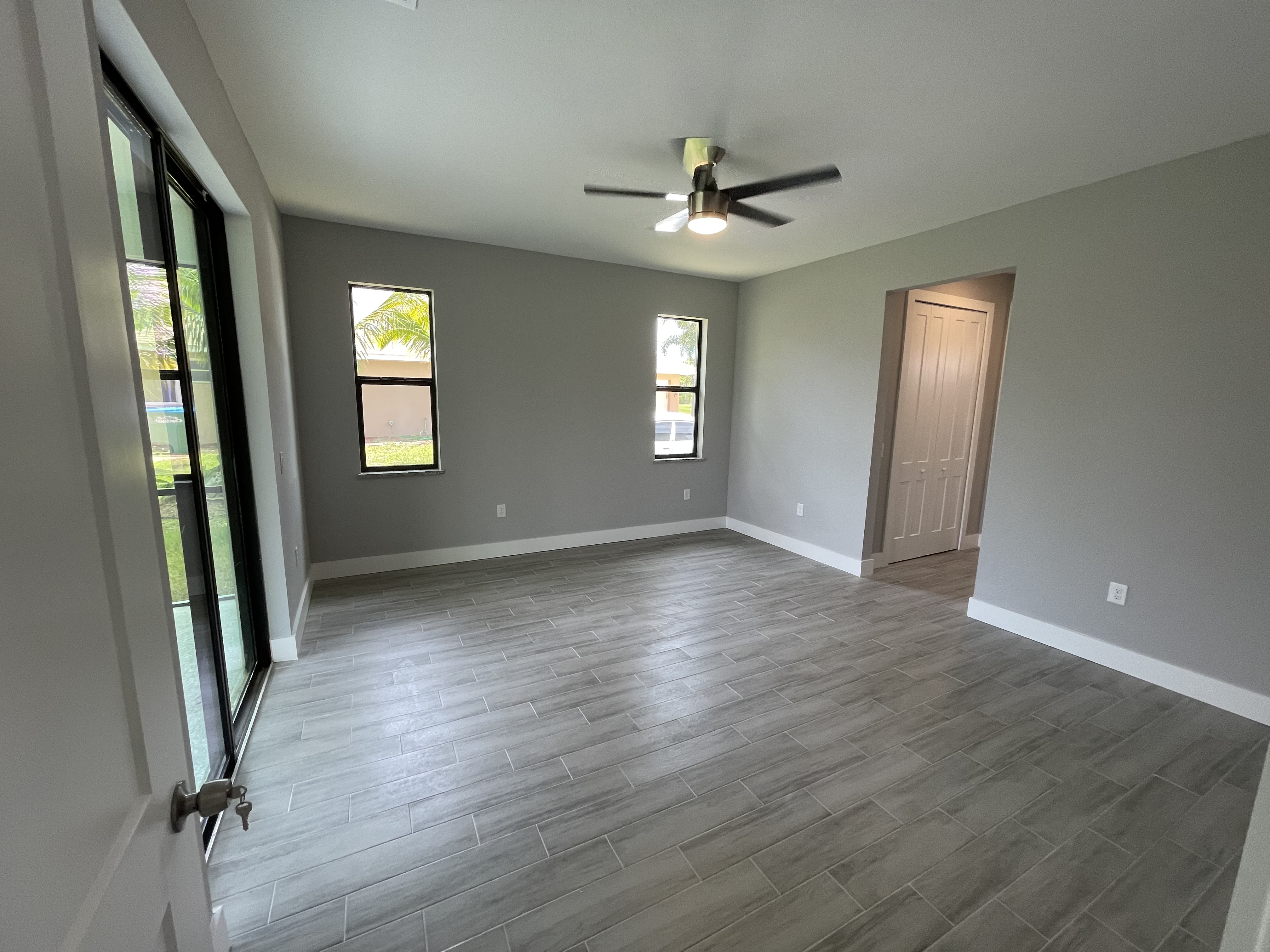 Raven secondary bedroom with sliding glass doors