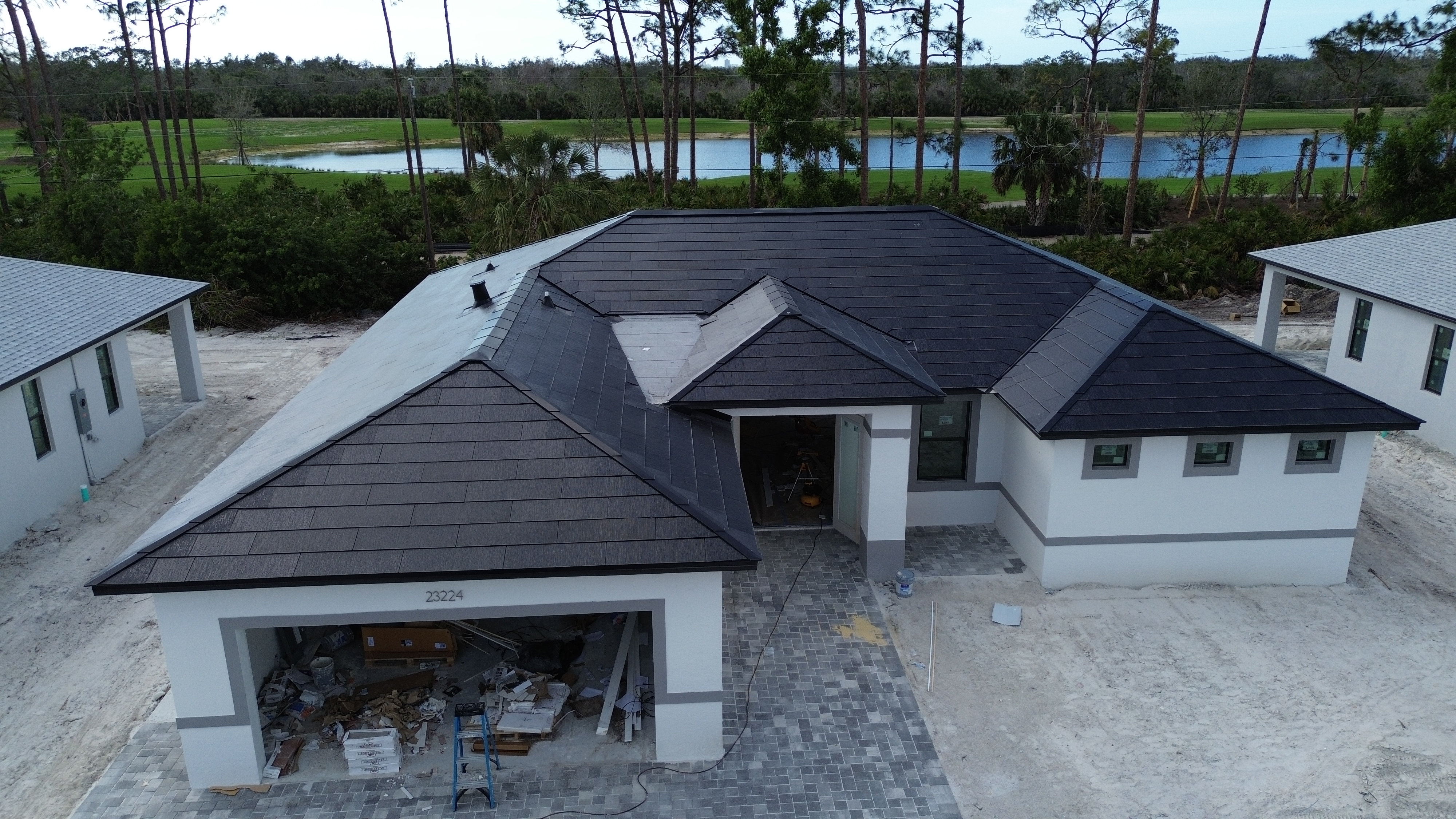 PrimeBid home under construction overlooking a lake in Southwest Florida