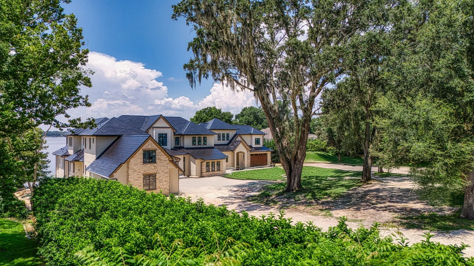 Completed PrimeBid estate home beneath mature oaks